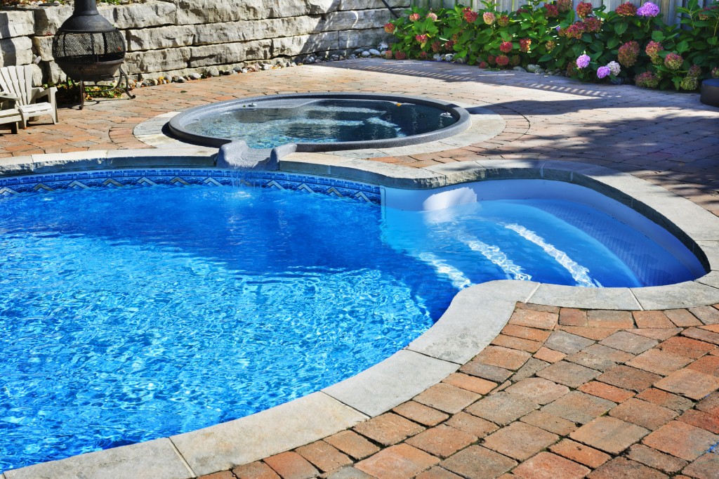 Swimming pool with hot tub